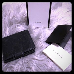 Gucci guccissima black leather wallet.